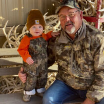 picture of Jim Lindeman and a grandson wearing camo in a profile picture for Texas Ranch Brokers of Burnet County where jim is an agent