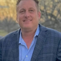 profile of Joey Whelan in a blue suite for his agent profile picture at Texas Ranch Brokers in Burnet County Texas